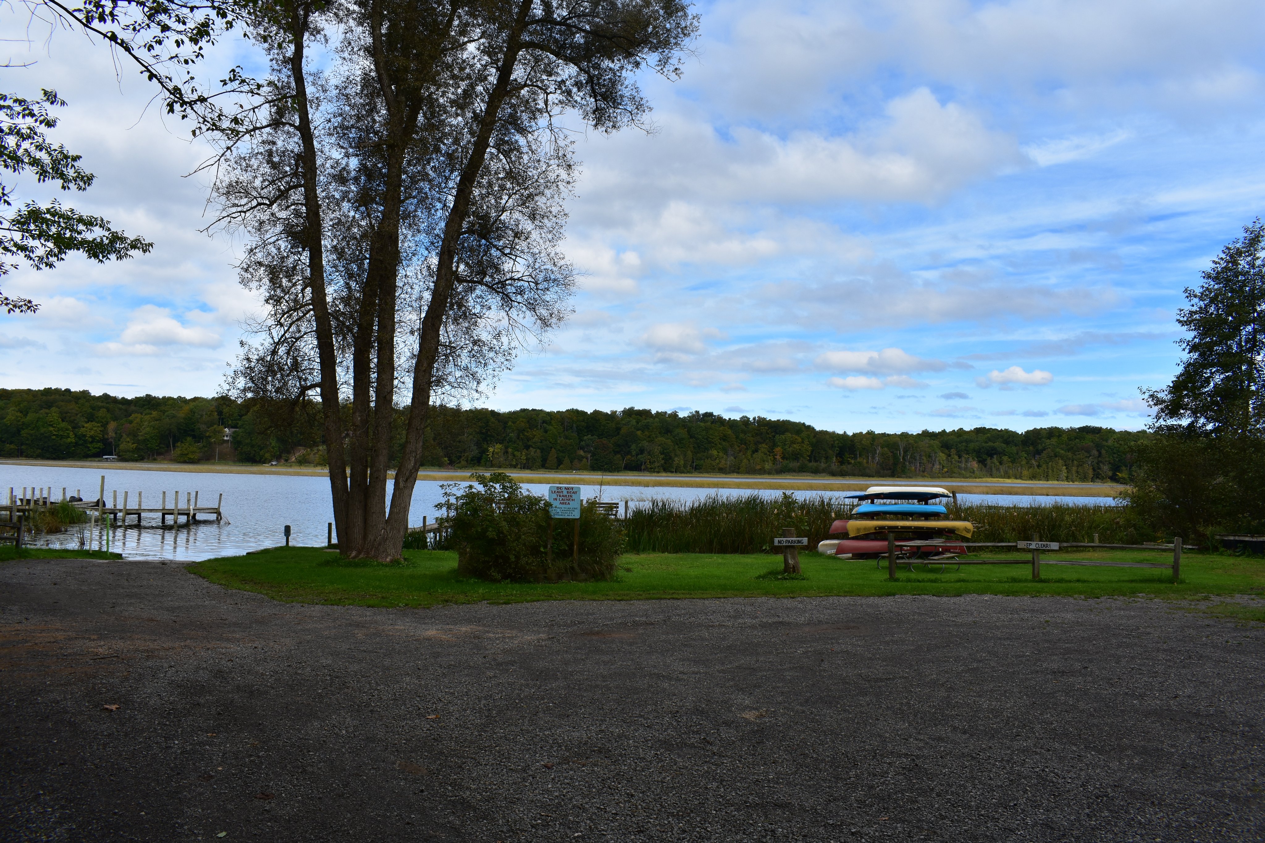 Kayaks and canoes beside the boat launch on Upper Hamlin Lake